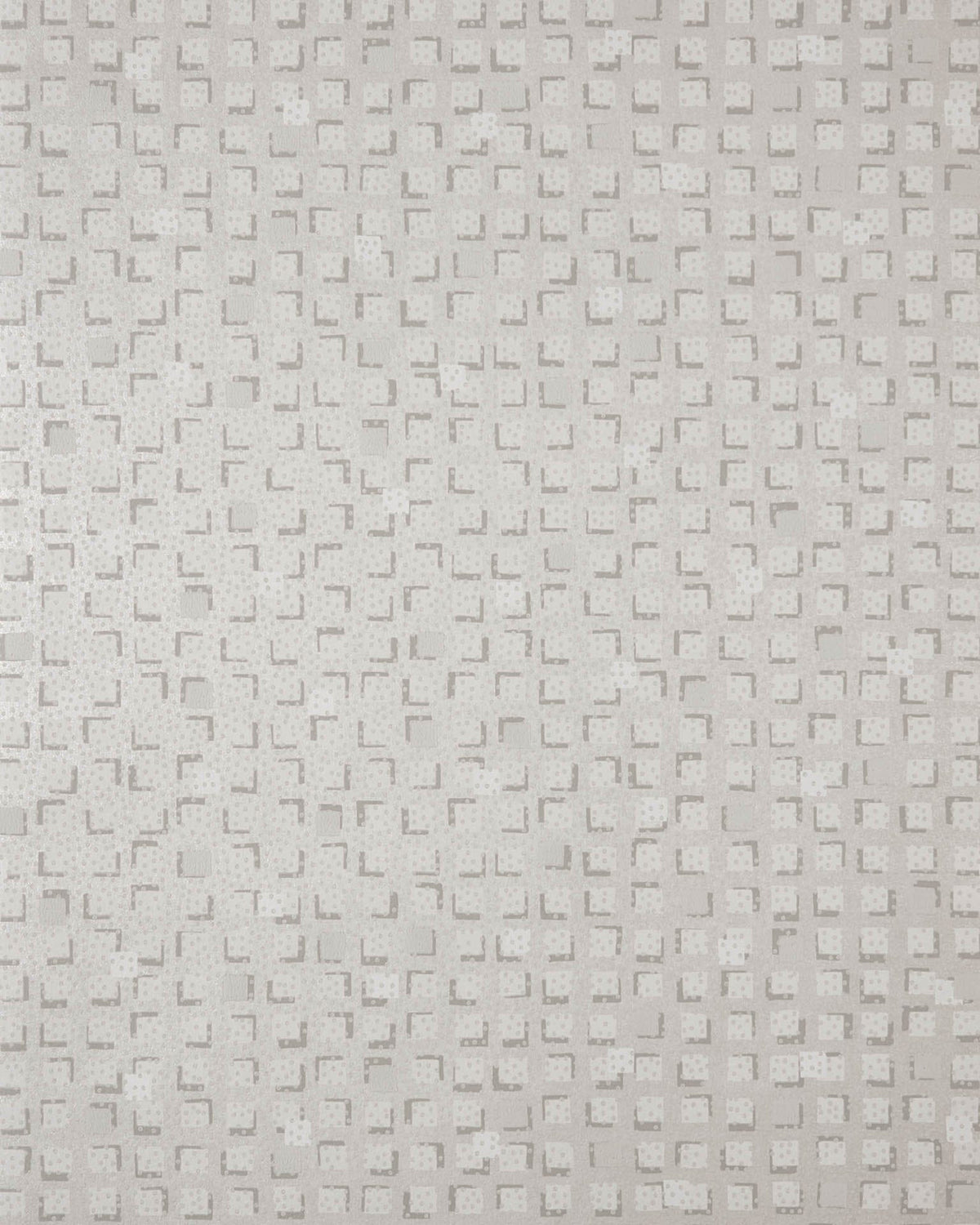 A close-up of a light beige textured material with a repeating embossed geometric pattern.